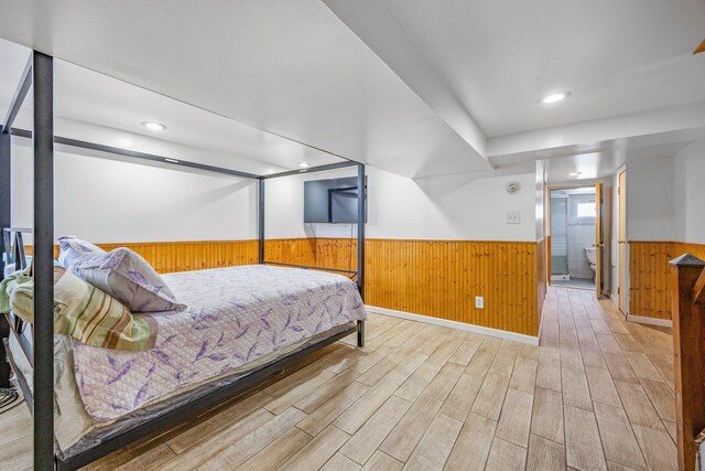 69-06 79th St, Middle Village, NY 11379 - bedroom featuring wainscoting, light wood-style flooring, and wood walls