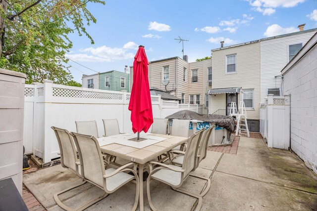 69-06 79th St, Middle Village, NY 11379 - view of patio / terrace featuring outdoor dining space and a fenced backyard