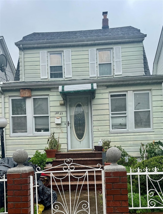 18823 Mangin Ave, Jamaica, NY 11412 - view of front facade with a chimney