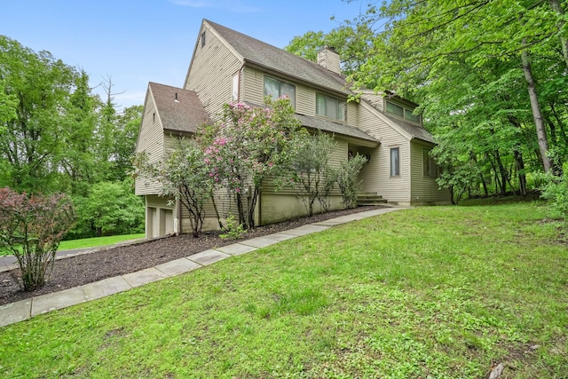 48 Sabbath Day Hill Rd, South Salem, NY 10590 - view of front of house with a garage, a chimney, a shingled roof, and a front lawn