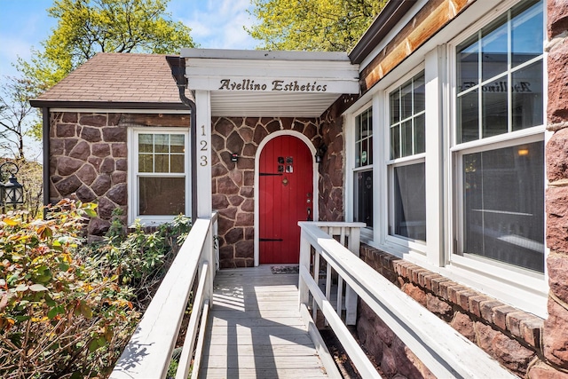 exterior space with stone siding
