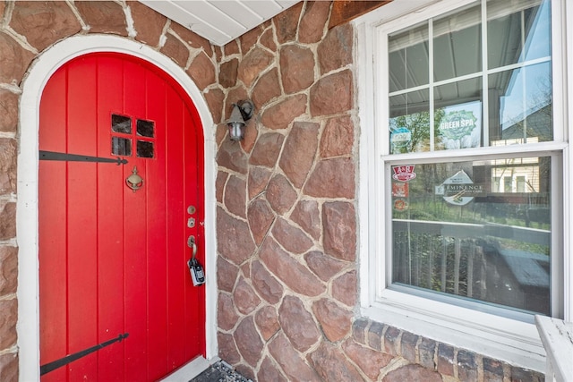 view of exterior entry with stone siding