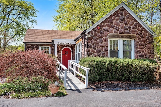 ranch-style home with stone siding