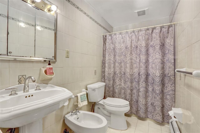 13042 NW 59th Ave, Flushing, NY 11355 - bathroom featuring tile patterned flooring, toilet, tile walls, a shower with shower curtain, and a sink
