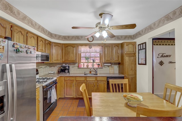 13042 NW 59th Ave, Flushing, NY 11355 - kitchen with a ceiling fan, brown cabinets, a sink, backsplash, and stainless steel appliances