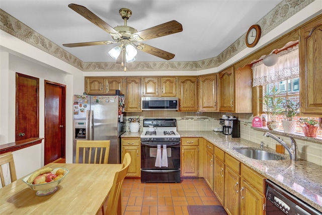 13042 NW 59th Ave, Flushing, NY 11355 - kitchen with ceiling fan, light stone counters, a sink, appliances with stainless steel finishes, and backsplash