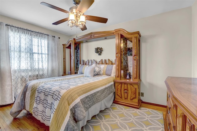 13042 NW 59th Ave, Flushing, NY 11355 - bedroom with baseboards, ceiling fan, and light wood-type flooring