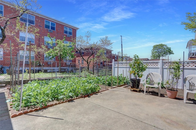 13042 NW 59th Ave, Flushing, NY 11355 - view of patio / terrace with fence and a vegetable garden