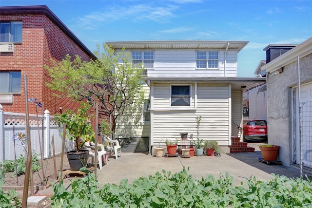 13042 NW 59th Ave, Flushing, NY 11355 - back of house with fence and a patio area