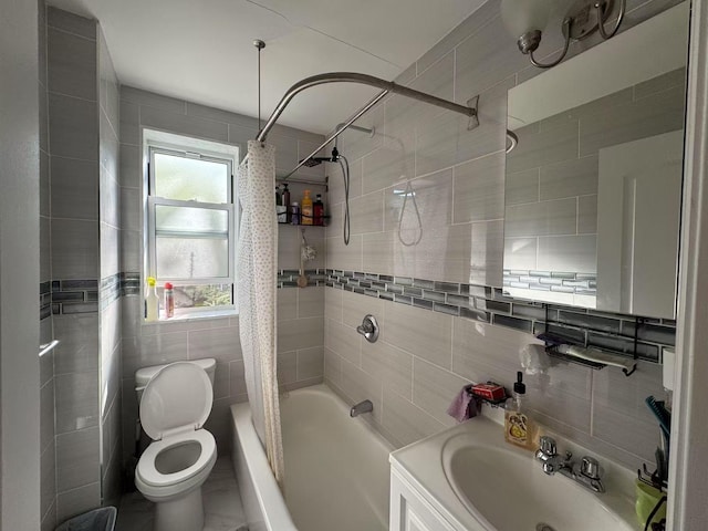 full bath with vanity, toilet, tile walls, and shower / tub combo with curtain