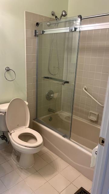 40 Jefferson Oval Unit A, Yorktown Heights, NY 10598 - bathroom featuring tile patterned flooring, toilet, and shower / bath combination with glass door