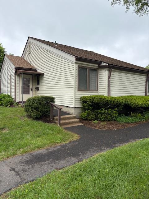 40 Jefferson Oval Unit A, Yorktown Heights, NY 10598 - view of home's exterior featuring a yard