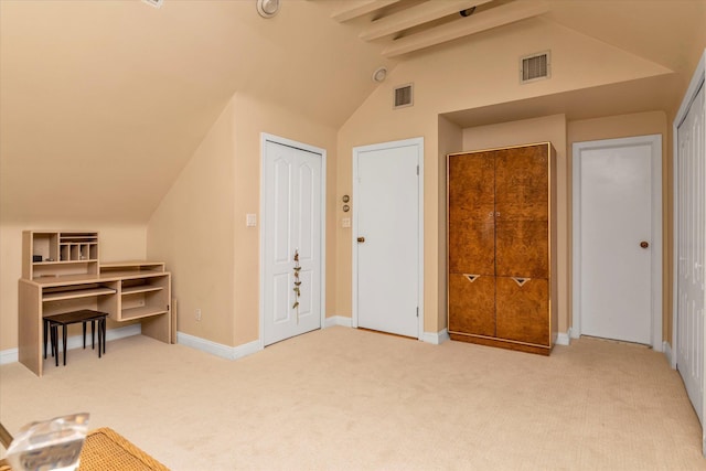 additional living space with carpet, visible vents, and lofted ceiling with beams