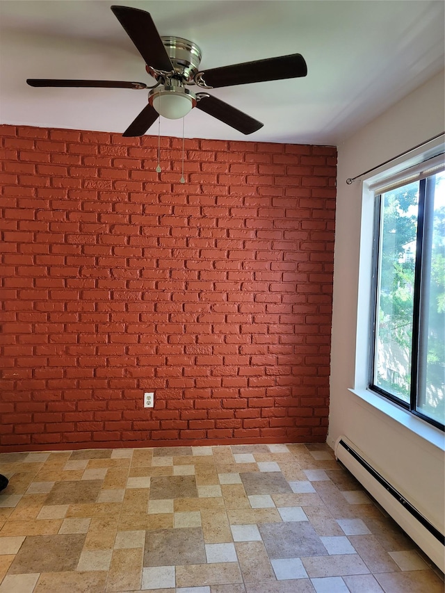 23 Hillside Ter Unit H, White Plains, NY 10601 - spare room with brick wall, a wealth of natural light, a baseboard radiator, and ceiling fan