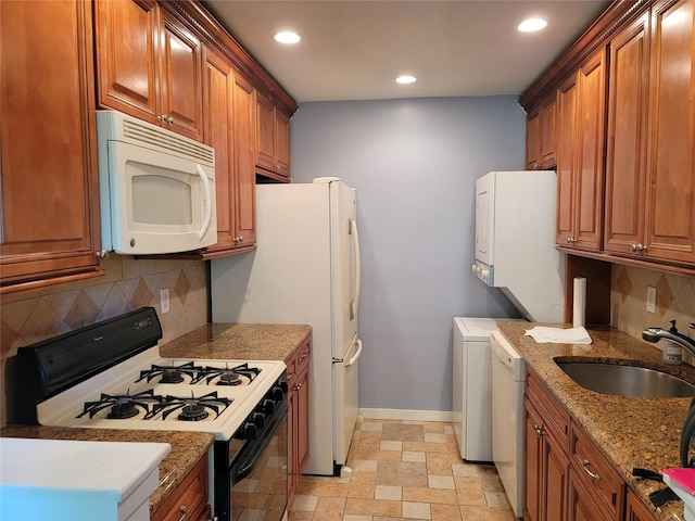 23 Hillside Ter Unit H, White Plains, NY 10601 - kitchen with brown cabinets, recessed lighting, backsplash, a sink, and white appliances