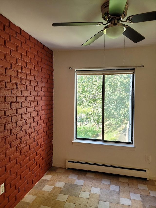 23 Hillside Ter Unit H, White Plains, NY 10601 - empty room featuring a baseboard heating unit, a healthy amount of sunlight, and brick wall