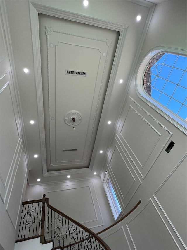room details with ornamental molding and recessed lighting
