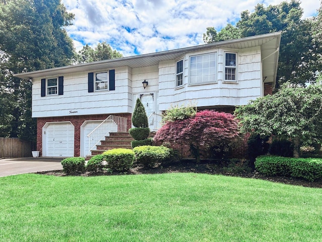 14 Scott St, Dix Hills, NY 11746 - split foyer home featuring concrete driveway, a garage, and brick siding