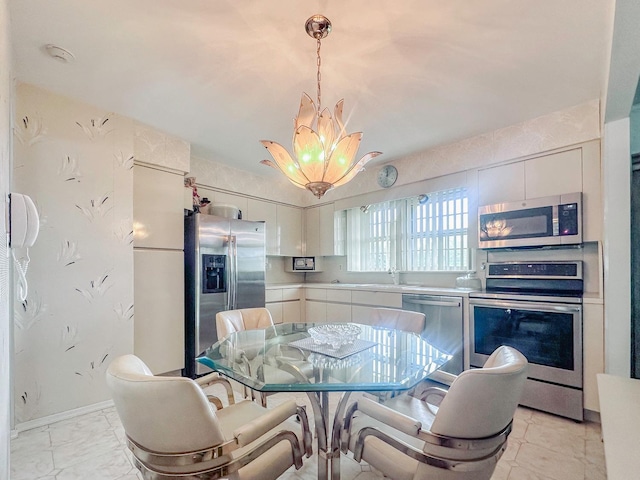 14 Scott St, Dix Hills, NY 11746 - dining space featuring a chandelier