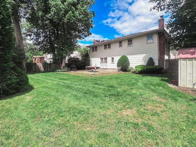 14 Scott St, Dix Hills, NY 11746 - rear view of property with a chimney and a patio