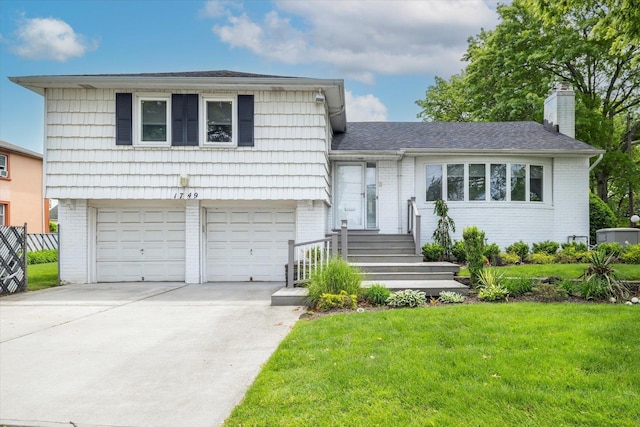 1749 Union Ave, Hewlett, NY 11557 - tri-level home with brick siding, an attached garage, and a front yard
