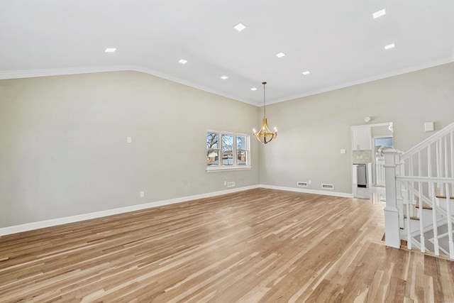 empty room featuring stairway, ornamental molding, light wood-style floors, baseboards, and a notable chandelier