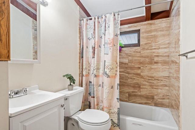 bathroom featuring toilet, vanity, and shower / tub combo with curtain