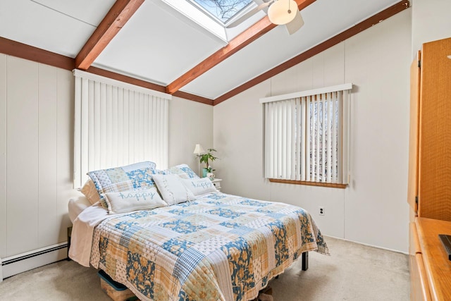 bedroom with vaulted ceiling with skylight, carpet, a baseboard radiator, and multiple windows