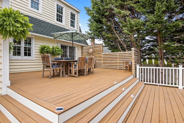 deck with outdoor dining space