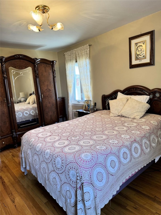 bedroom with hardwood / wood-style floors