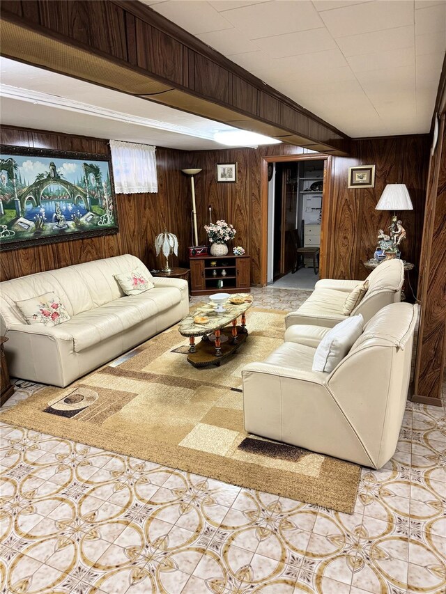living area with light tile patterned flooring and wood walls