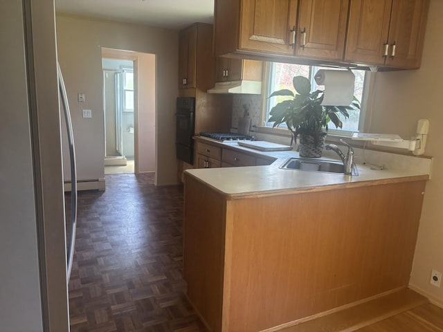 60 Hewitt Blvd, Center Moriches, NY 11934 - kitchen with a healthy amount of sunlight, stainless steel gas stovetop, a baseboard heating unit, and a sink