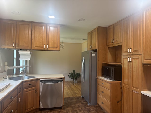 60 Hewitt Blvd, Center Moriches, NY 11934 - kitchen featuring brown cabinetry, appliances with stainless steel finishes, light countertops, and a sink