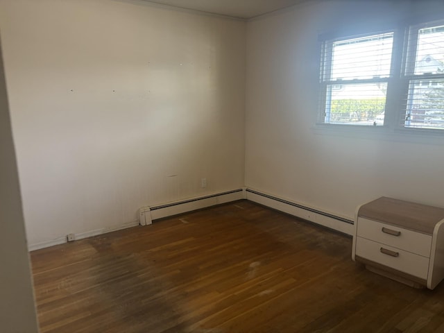 60 Hewitt Blvd, Center Moriches, NY 11934 - empty room with crown molding, baseboards, wood finished floors, and a baseboard radiator