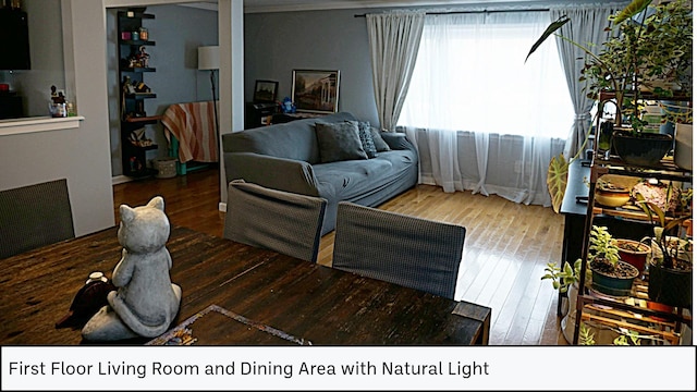 living room with visible vents and wood-type flooring