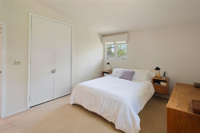 carpeted bedroom with a closet