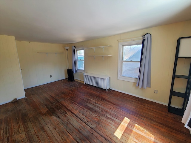 108 Main St, Livingston Manor, NY 12758 - unfurnished living room featuring radiator and wood-type flooring