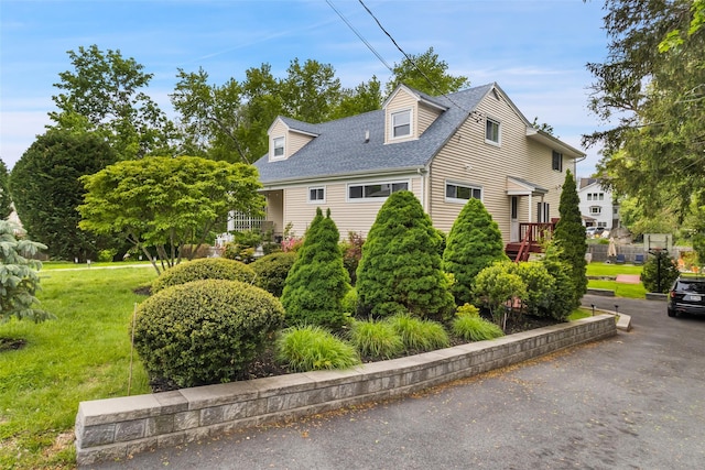 20 Brook St, Mount Kisco, NY 10549 - view of front facade with a shingled roof and a front yard