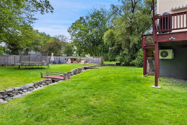 20 Brook St, Mount Kisco, NY 10549 - view of yard featuring a trampoline, a deck, and ac unit
