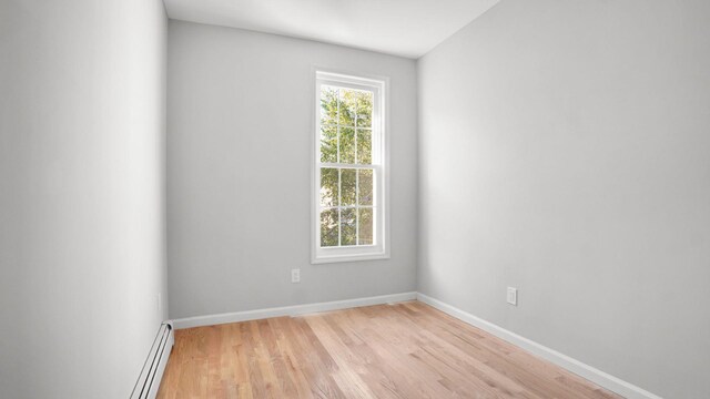 679 E 221st St, Bronx, NY 10467 - spare room featuring light wood finished floors, baseboards, and baseboard heating