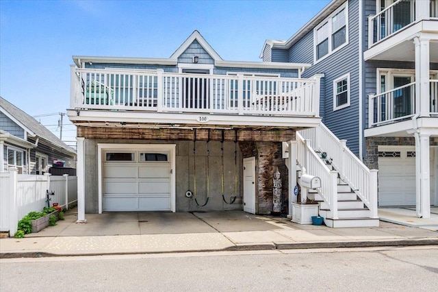 100 California St, Long Beach, NY 11561 - view of front of house with fence and a garage