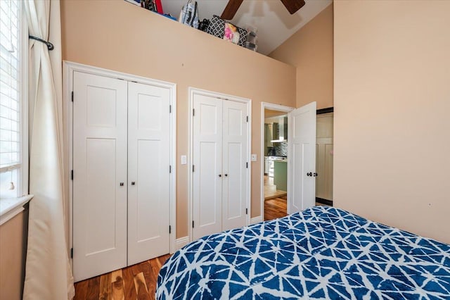 100 California St, Long Beach, NY 11561 - bedroom with multiple closets, ceiling fan, a high ceiling, and wood finished floors