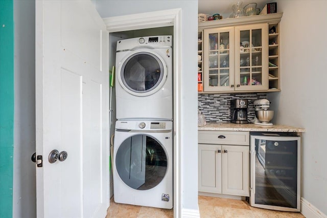 100 California St, Long Beach, NY 11561 - laundry room featuring stacked washer and dryer and beverage cooler