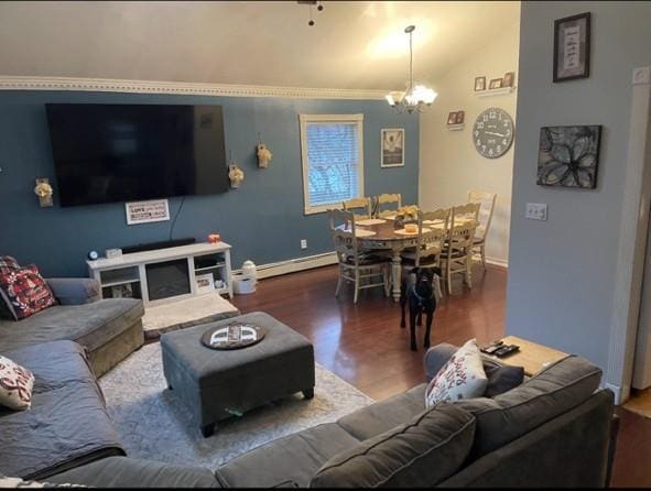 living area with wood finished floors, a chandelier, a baseboard radiator, lofted ceiling, and baseboards
