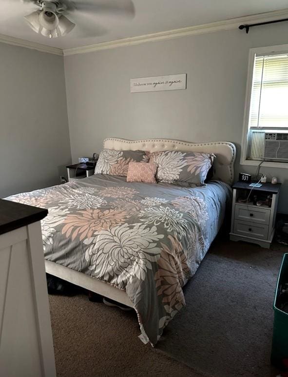 bedroom with carpet flooring, ornamental molding, a ceiling fan, and cooling unit