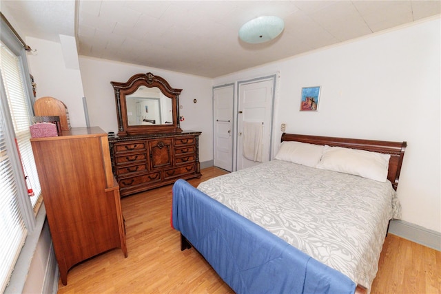 8521 80th St, Woodhaven, NY 11421 - bedroom with light wood-style flooring and ornamental molding