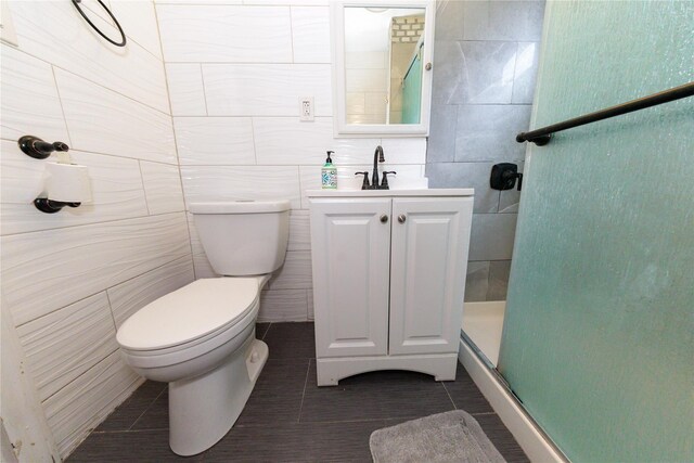 8521 80th St, Woodhaven, NY 11421 - full bathroom with toilet, tile walls, a shower stall, vanity, and tile patterned flooring