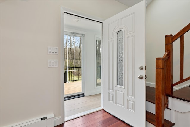 12 W Wind Rd, Pawling, NY 12564 - entryway featuring a baseboard radiator, wood finished floors, and stairway