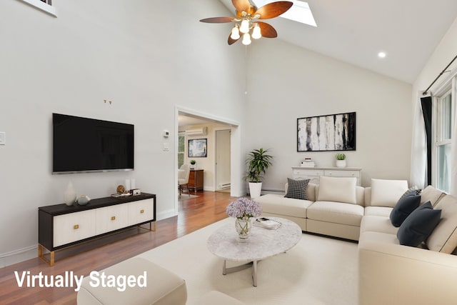 12 W Wind Rd, Pawling, NY 12564 - living area featuring wood finished floors, a ceiling fan, a baseboard radiator, recessed lighting, and high vaulted ceiling