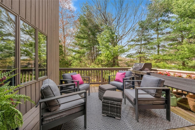 deck featuring grilling area and an outdoor hangout area
